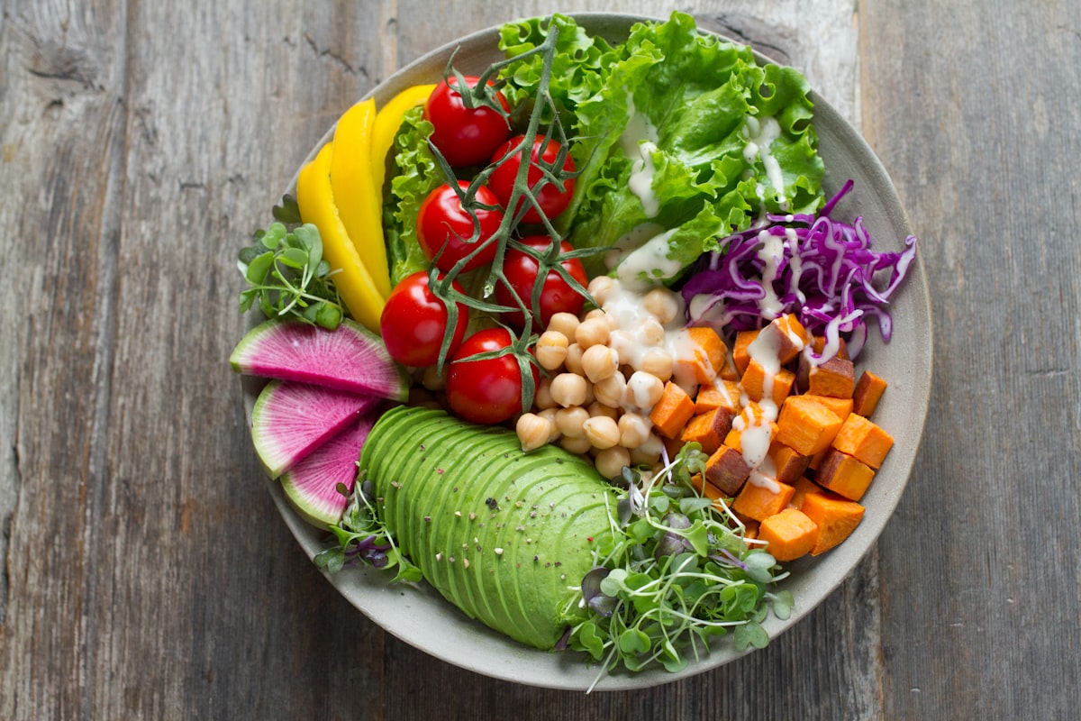 Colorful fresh vegetables and fruits arranged on a table